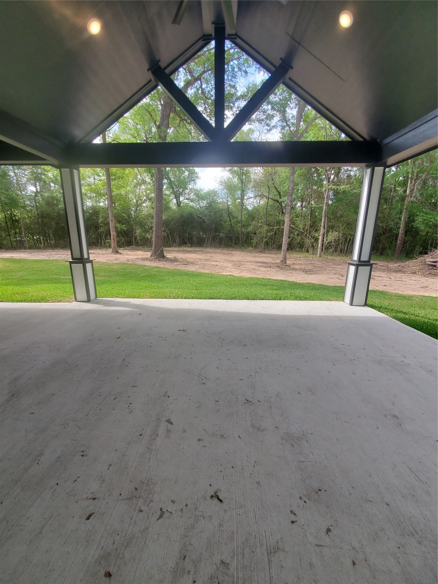 24647 Oak Creek Road Hockley, TX 77447 - Photo 36 of 47 a view of an empty room with a floor to ceiling windows with garden view