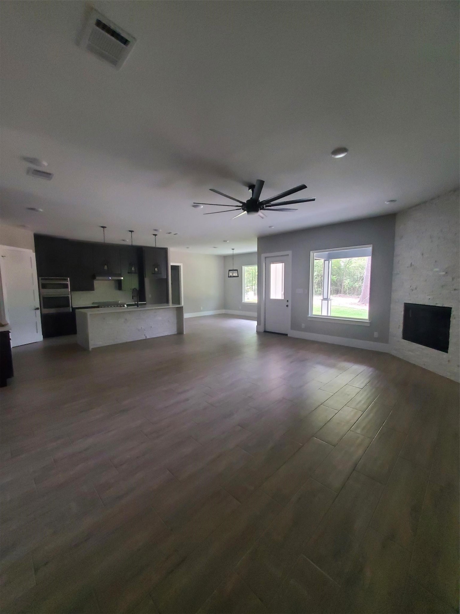24647 Oak Creek Road Hockley, TX 77447 - Photo 7 of 47 an empty room with windows and fireplace