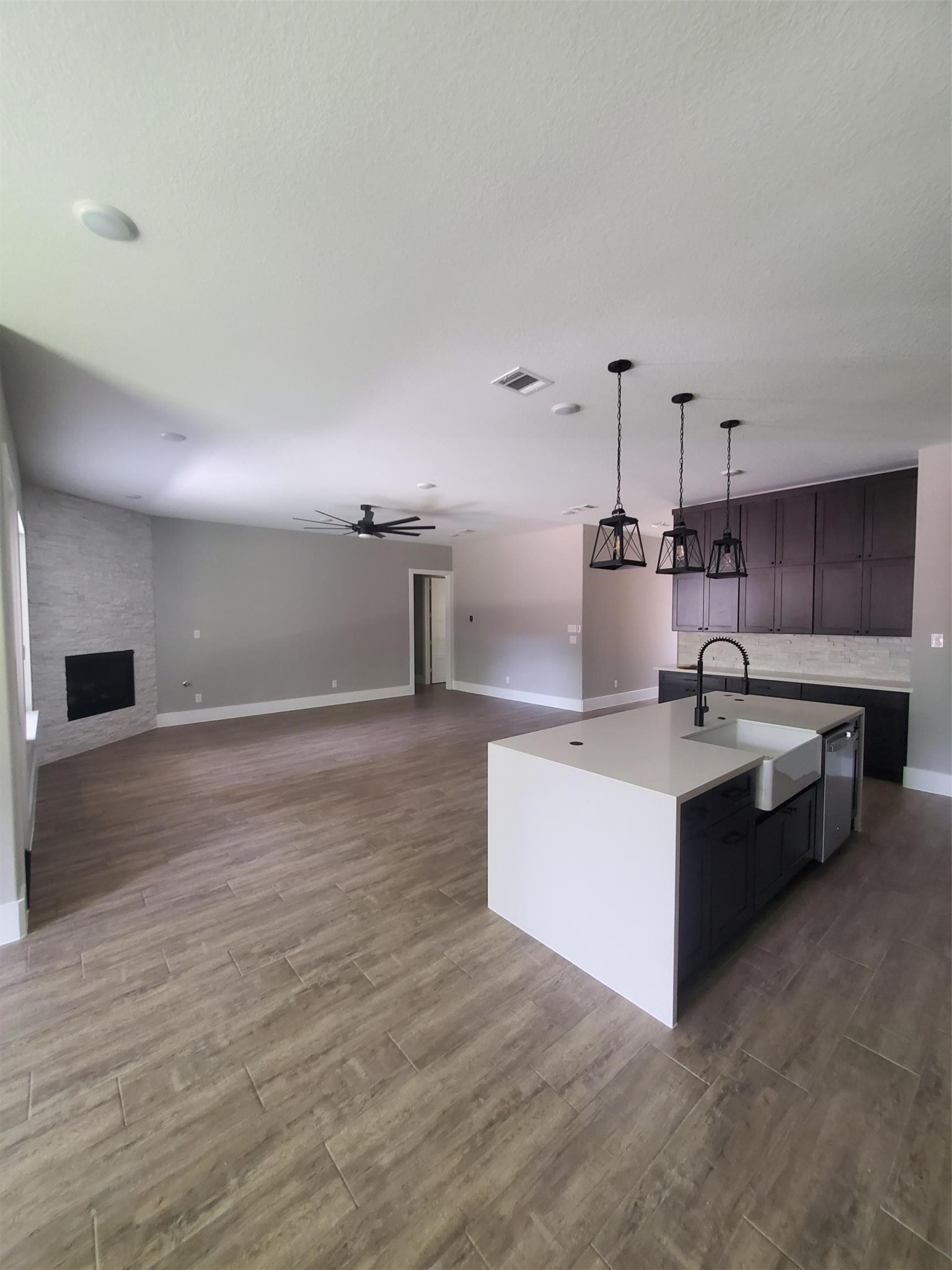 24647 Oak Creek Road Hockley, TX 77447 - Photo 8 of 47 a large kitchen with kitchen island a sink stainless steel appliances and cabinets