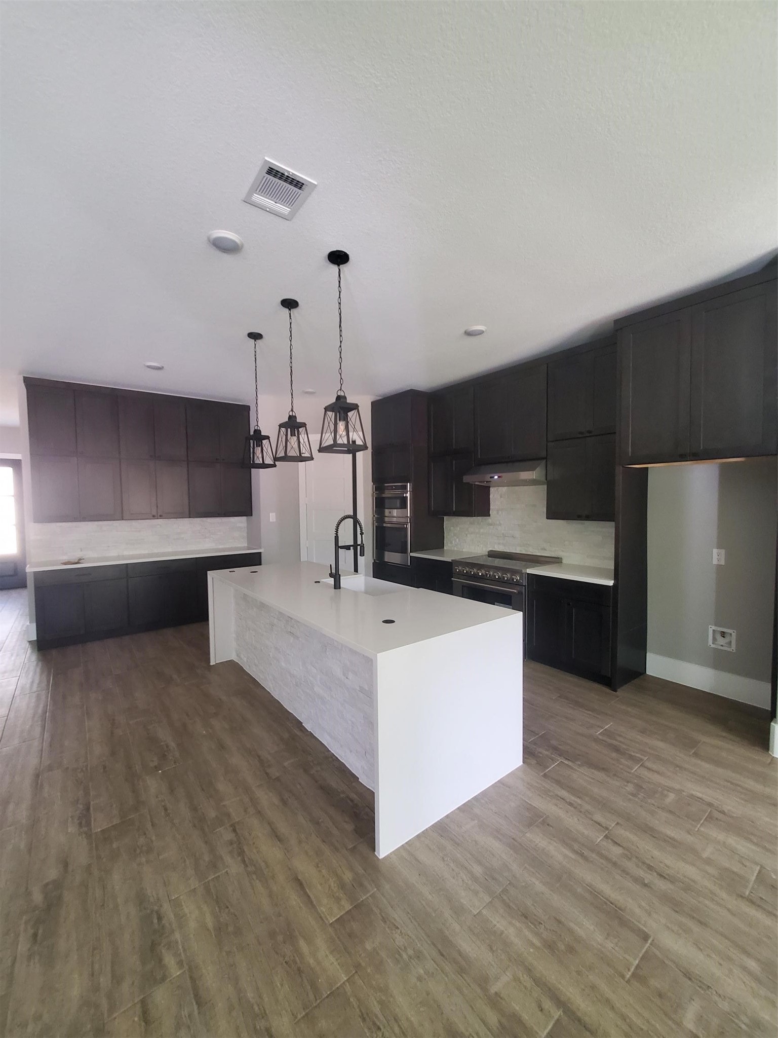 24647 Oak Creek Road Hockley, TX 77447 - Photo 9 of 47 a view of kitchen with stainless steel appliances sink and wooden floor