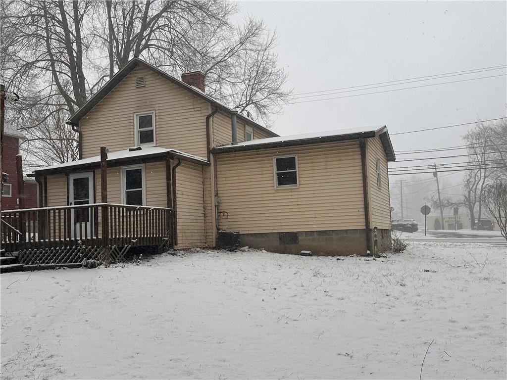 283 Portersville Road Ellwood City, PA 16117 - Photo 2 of 19 a view of a house with a yard covered in snow