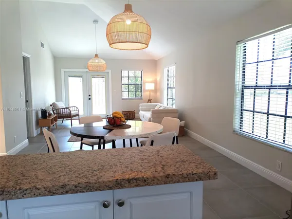 a view of a dining room with furniture window and outside view