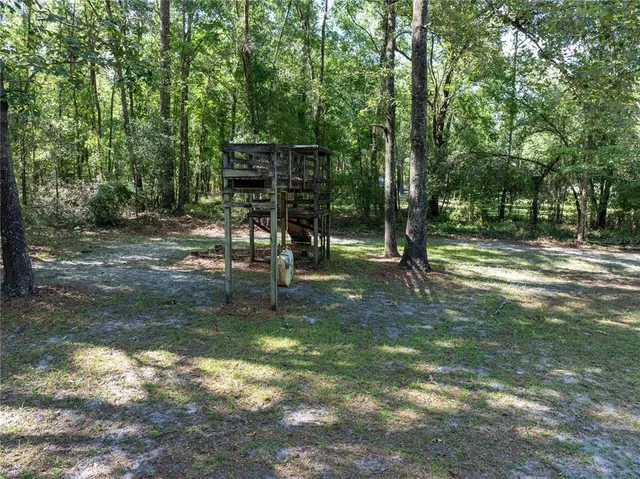 a backyard of a house with lots of green space