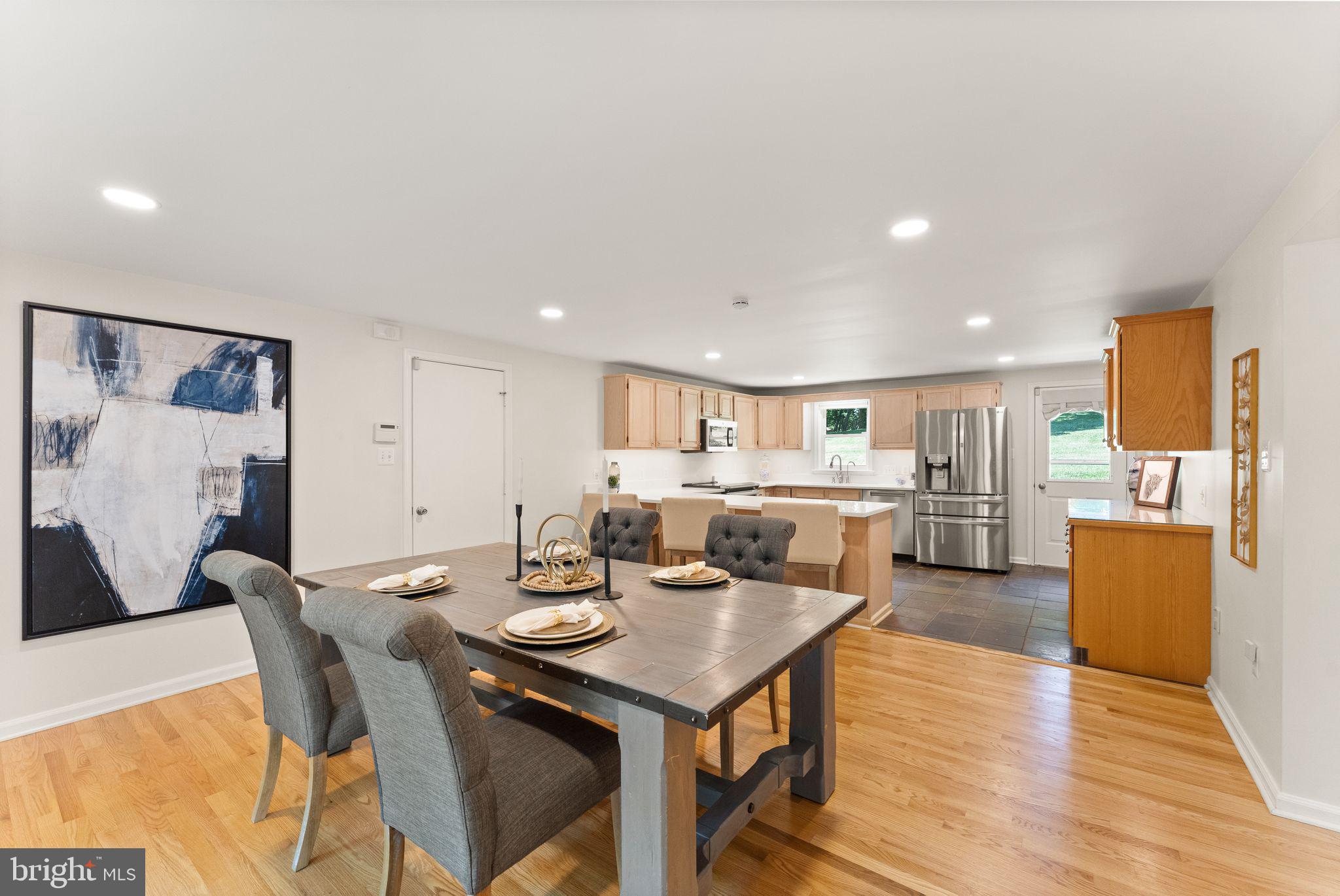 38620 Lime Kiln Road Leesburg, VA 20175 - Photo 37 of 87 a view of a dining room with furniture and wooden floor