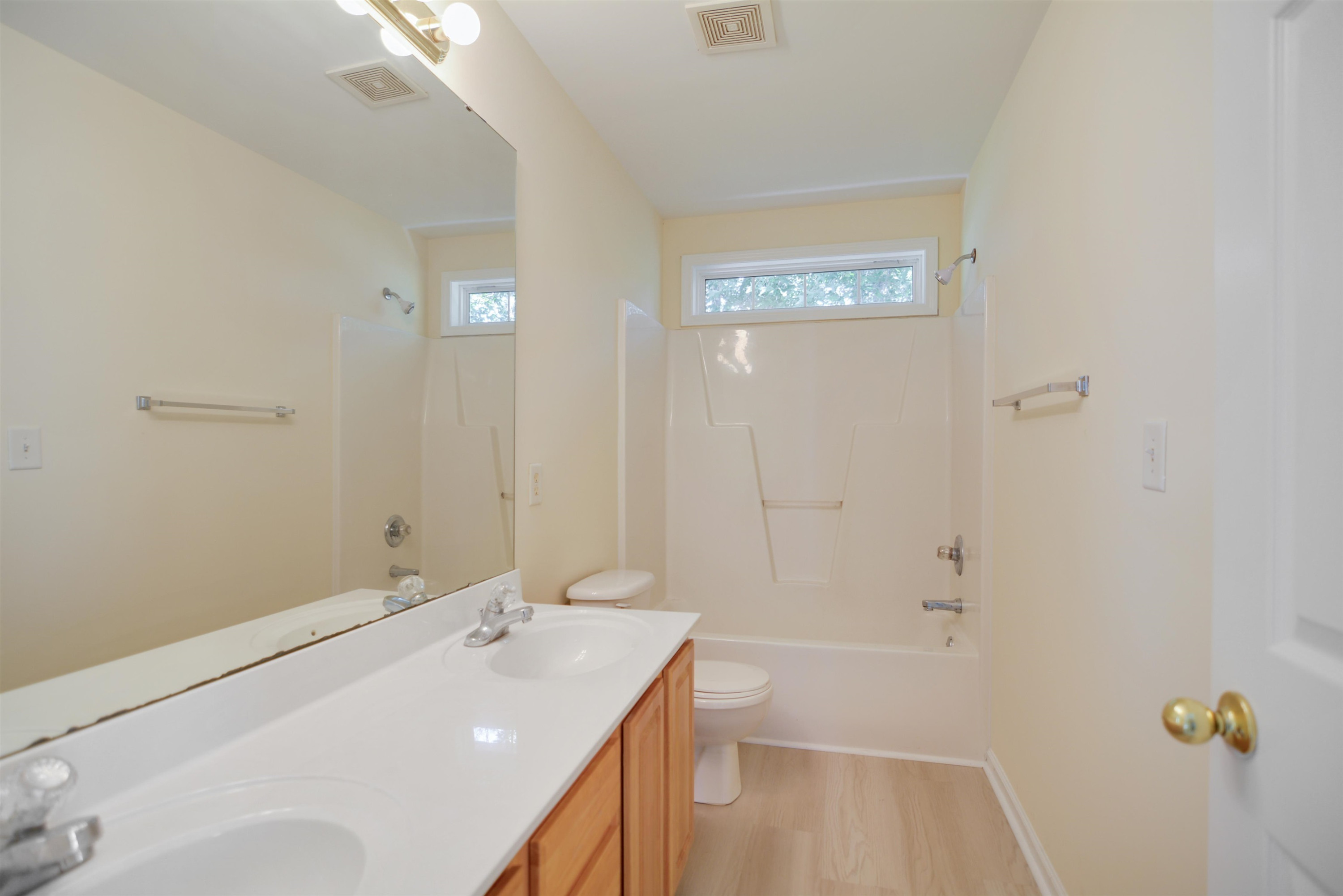 2708 Upper Dry Falls Court Raleigh, NC 27603 - Photo 12 of 16 a bathroom with a tub a sink and mirror