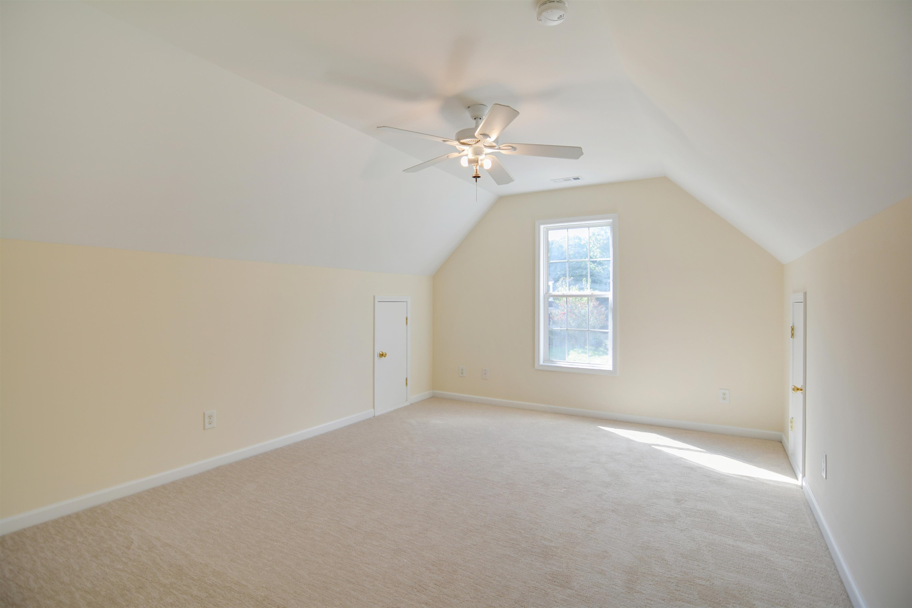 2708 Upper Dry Falls Court Raleigh, NC 27603 - Photo 13 of 16 an empty room with a window and a ceiling fan