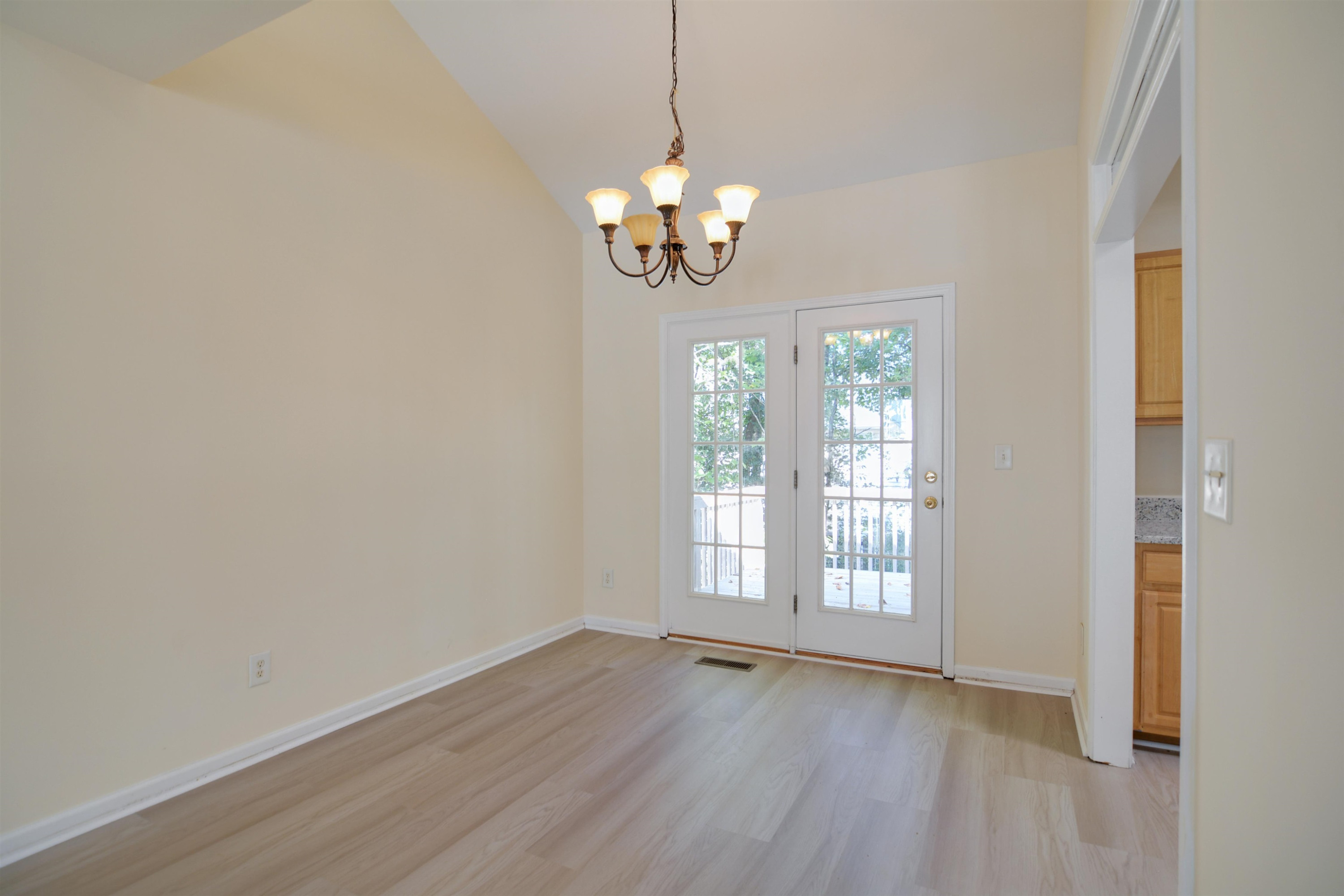 2708 Upper Dry Falls Court Raleigh, NC 27603 - Photo 5 of 16 a view of wooden floor and windows in a room