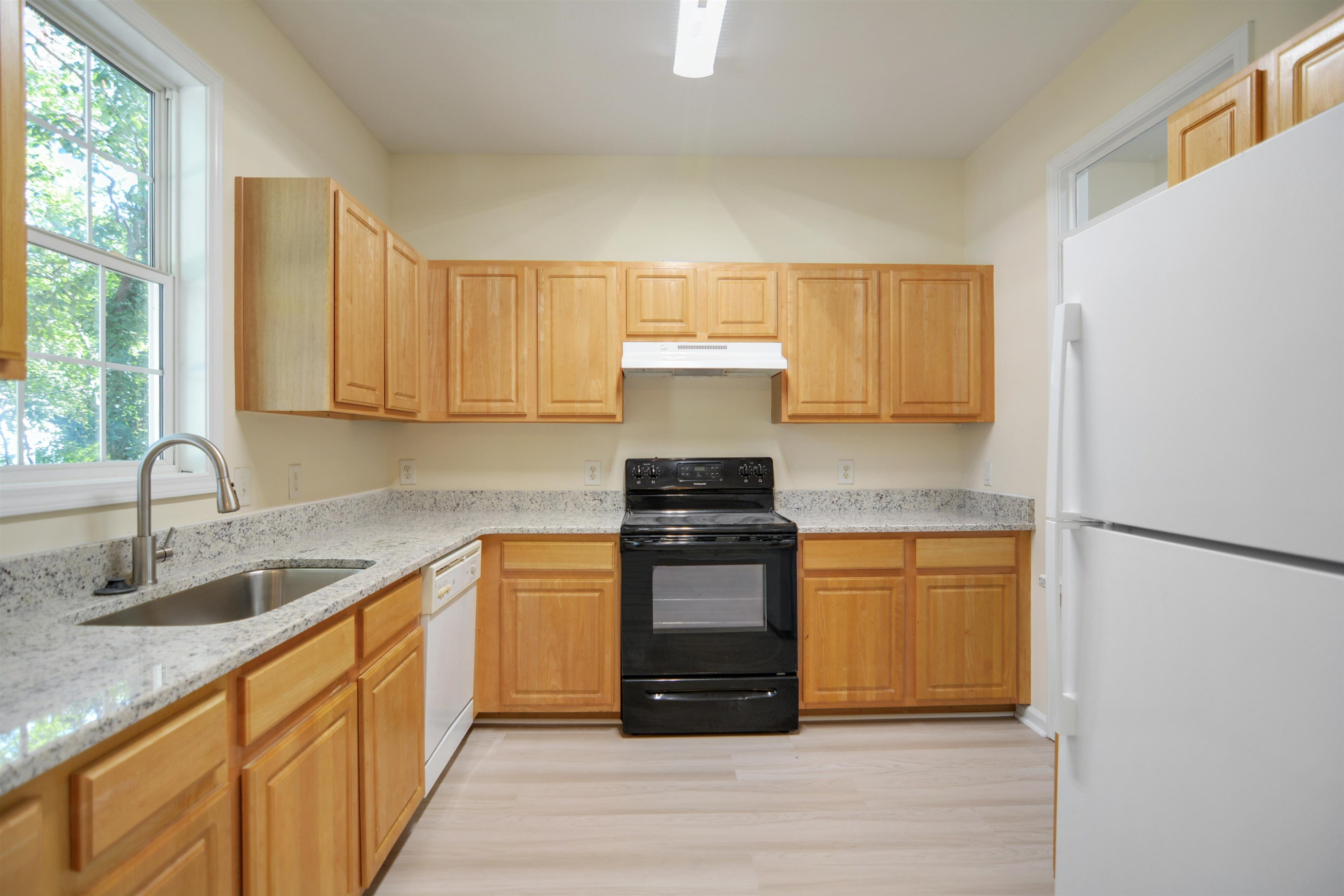 2708 Upper Dry Falls Court Raleigh, NC 27603 - Photo 6 of 16 a kitchen with stainless steel appliances granite countertop a sink stove and refrigerator