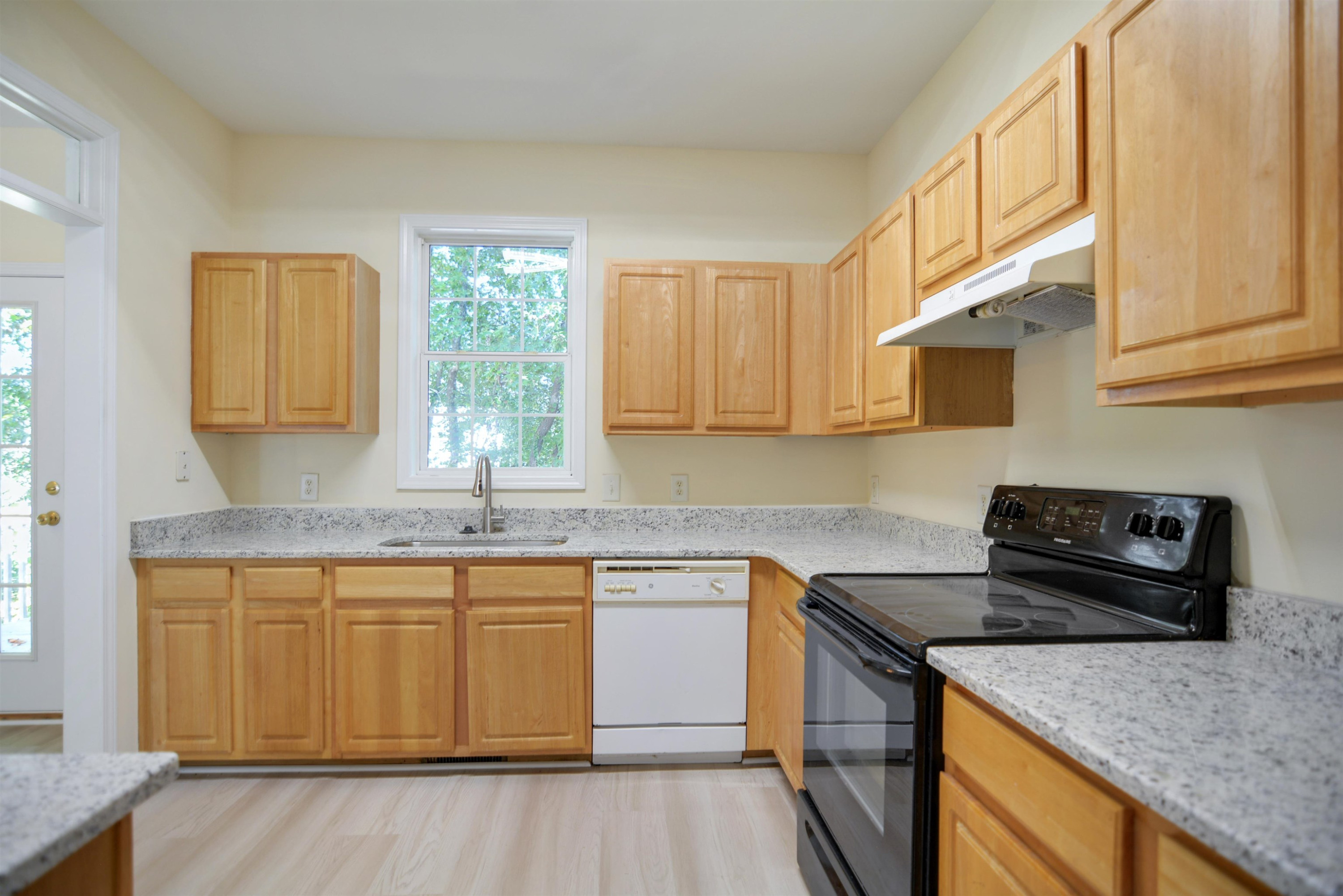 2708 Upper Dry Falls Court Raleigh, NC 27603 - Photo 7 of 16 a kitchen with stainless steel appliances granite countertop a sink stove and cabinets