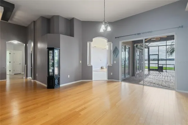 a large kitchen with stainless steel appliances granite countertop a stove a sink and a microwave