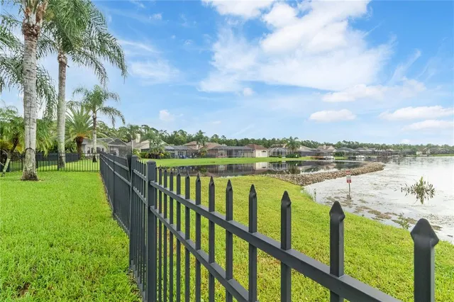 a view of a swimming pool and a yard