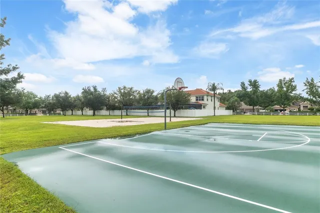 an aerial view of a house with a lake view
