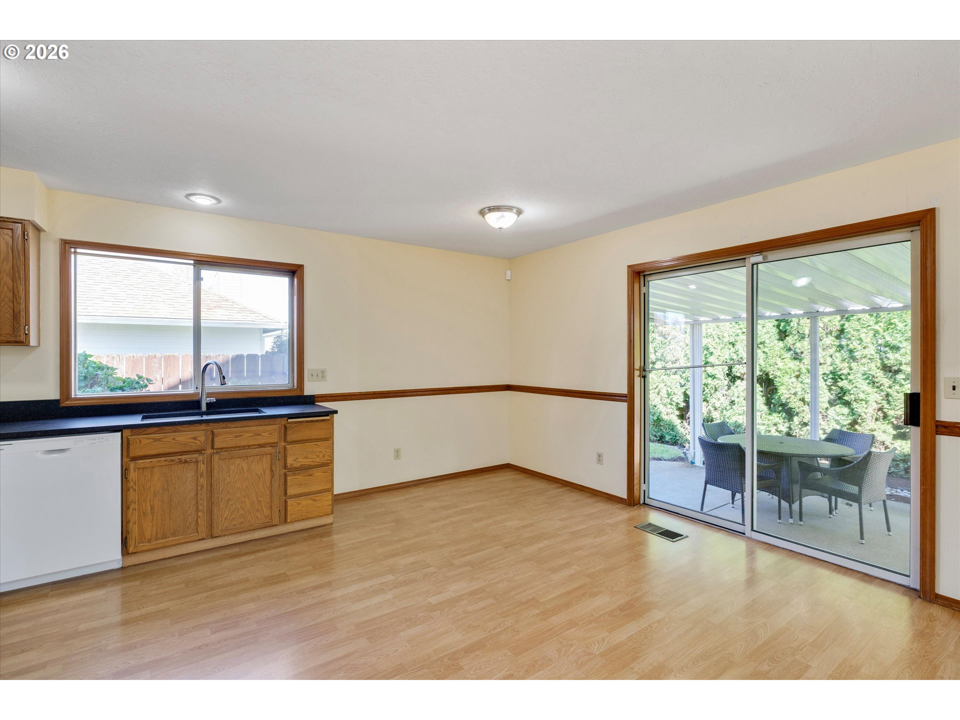 1360 North Locust Street Canby, OR 97013 - Photo 12 of 36 a view of an empty room with a window