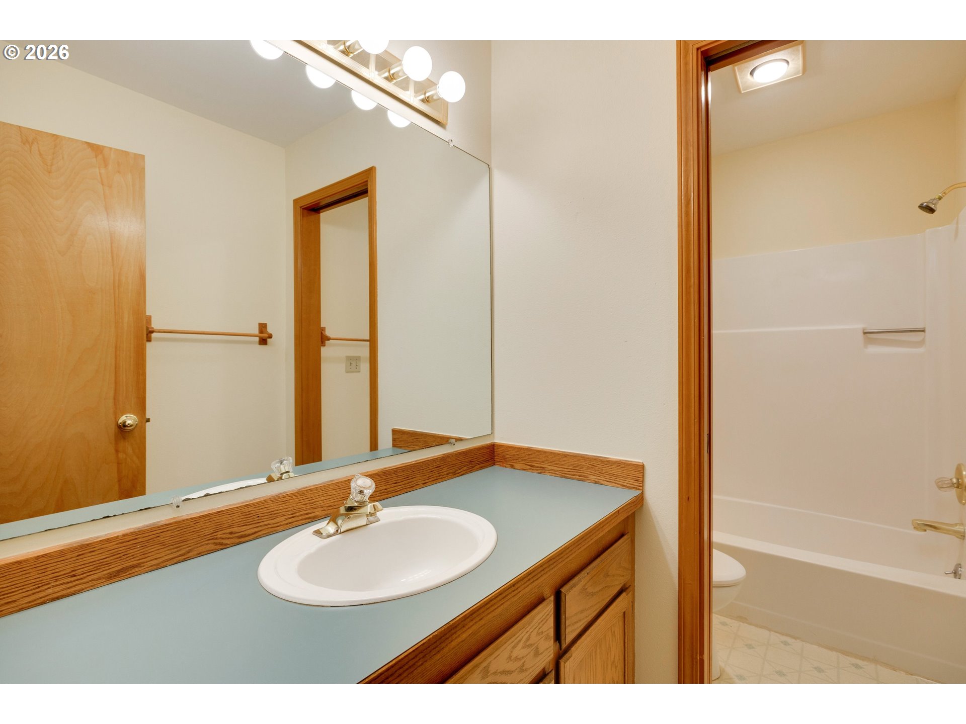 1360 North Locust Street Canby, OR 97013 - Photo 24 of 36 a bathroom with a sink and a mirror