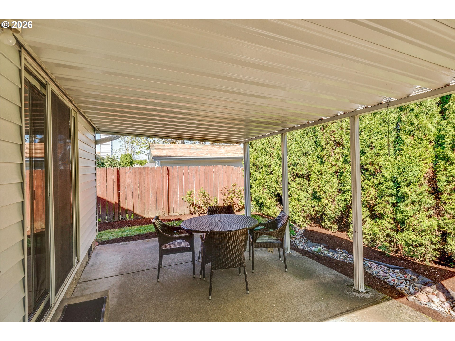 1360 North Locust Street Canby, OR 97013 - Photo 26 of 36 a patio with table and chairs