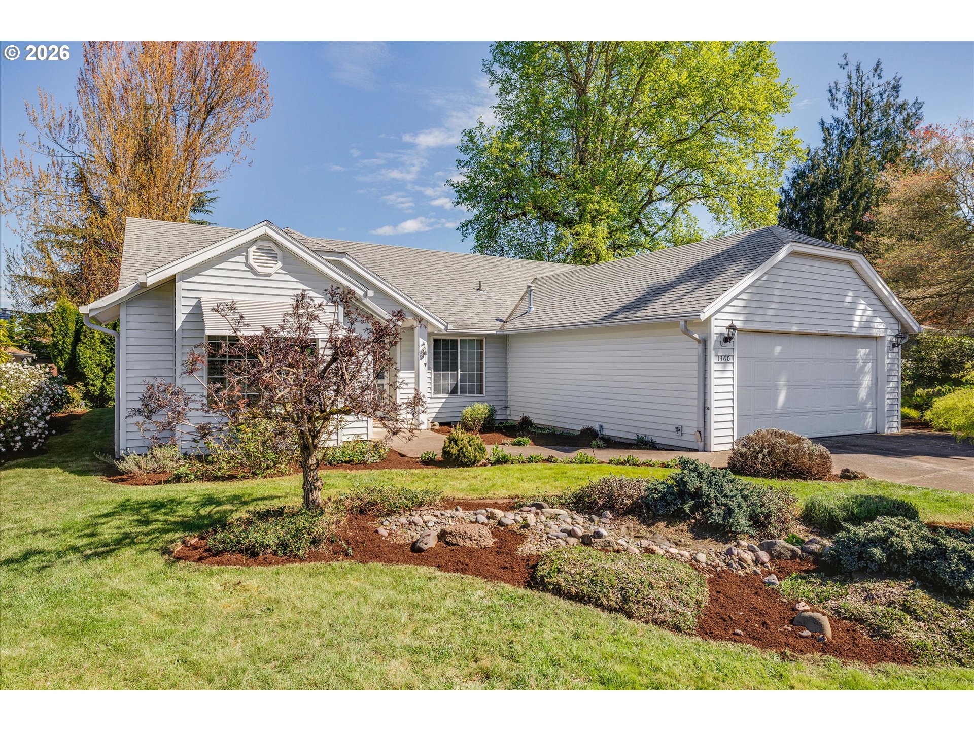 1360 North Locust Street Canby, OR 97013 - Photo 3 of 36 a aerial view of a house with a yard and potted plants