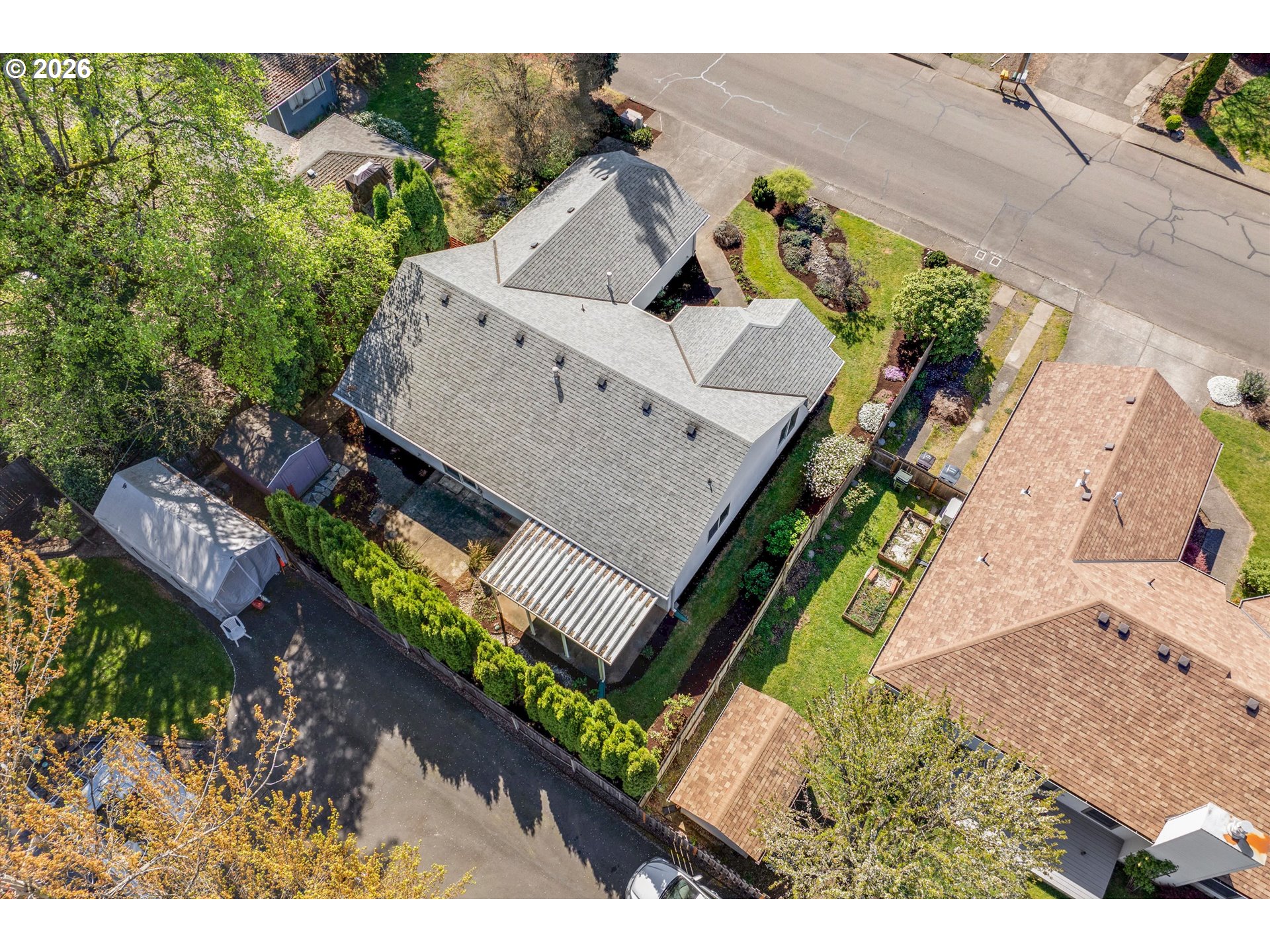 1360 North Locust Street Canby, OR 97013 - Photo 35 of 36 an aerial view of a house with a garden and mountain view