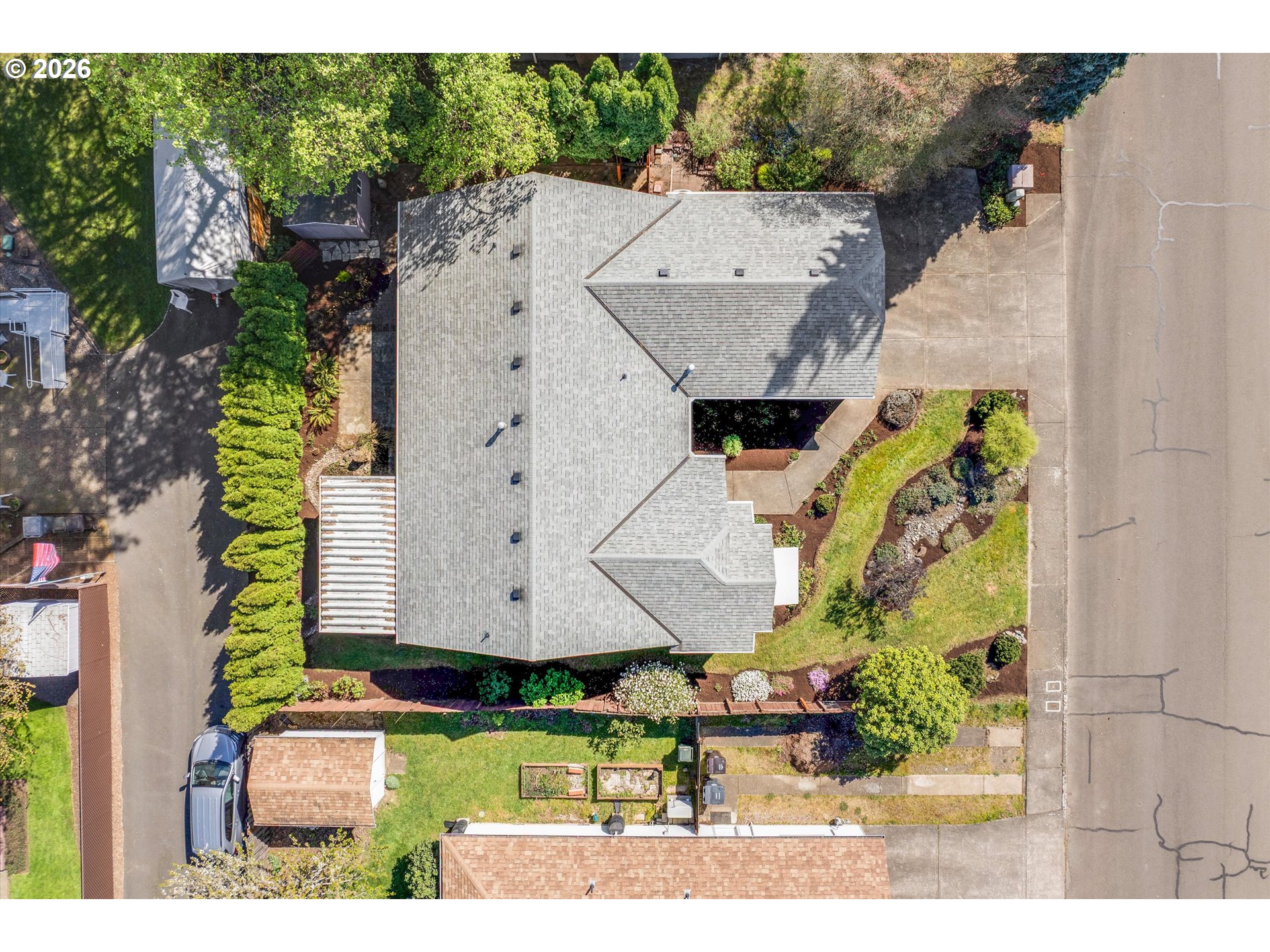 1360 North Locust Street Canby, OR 97013 - Photo 36 of 36 a aerial view of a house with a garden and plants
