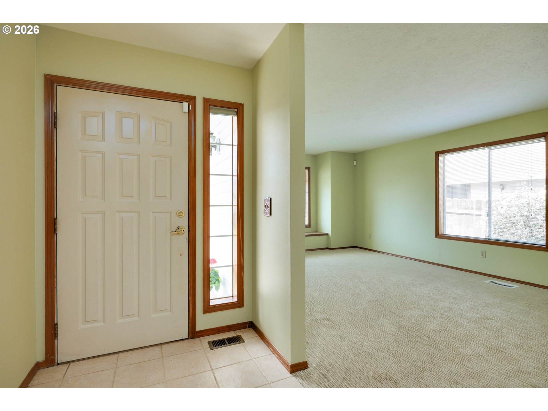 1360 North Locust Street Canby, OR 97013 - Photo 5 of 36 a view of an empty room and window