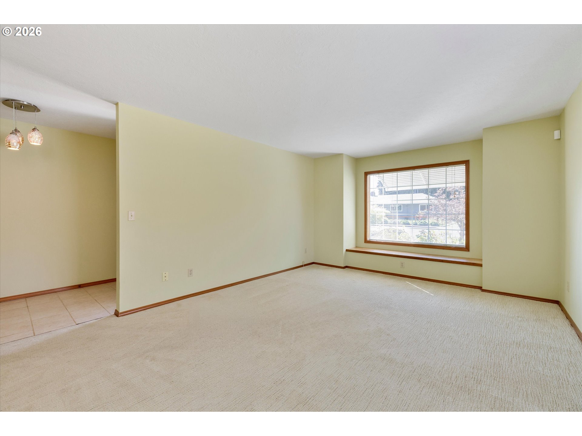 1360 North Locust Street Canby, OR 97013 - Photo 7 of 36 a view of an empty room with a window