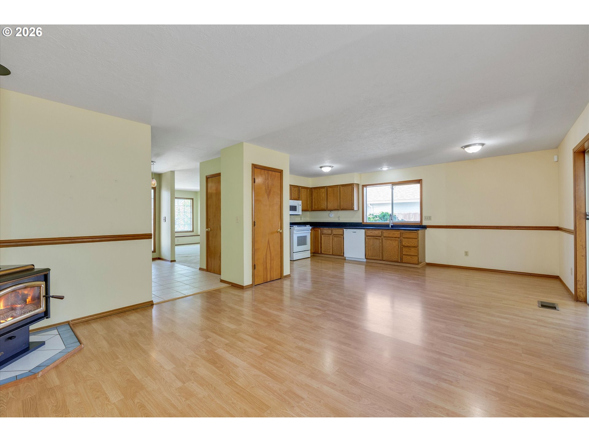 1360 North Locust Street Canby, OR 97013 - Photo 10 of 36 a view of a hallway with wooden floor