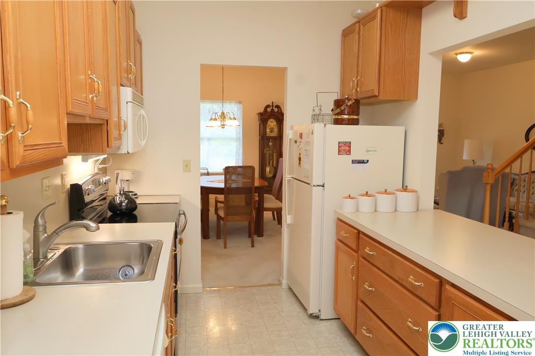 1282 Old Gate Road Northampton, PA 18067 - Photo 4 of 18 A functional kitchen provides ample counter space, bright cabinetry, and easy access to the adjacent dining area.