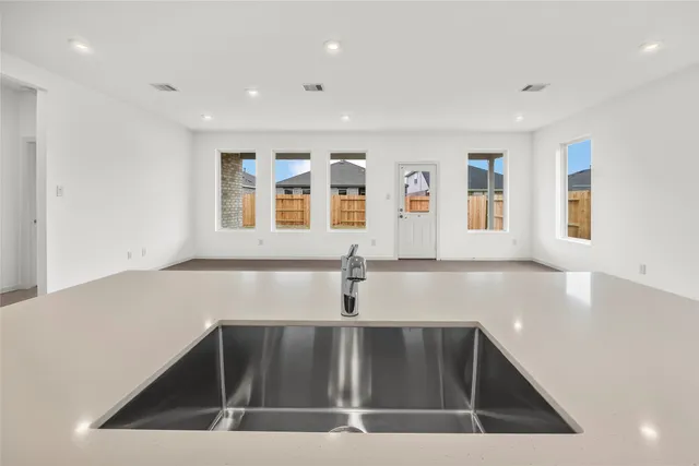 a view of an empty room and a window