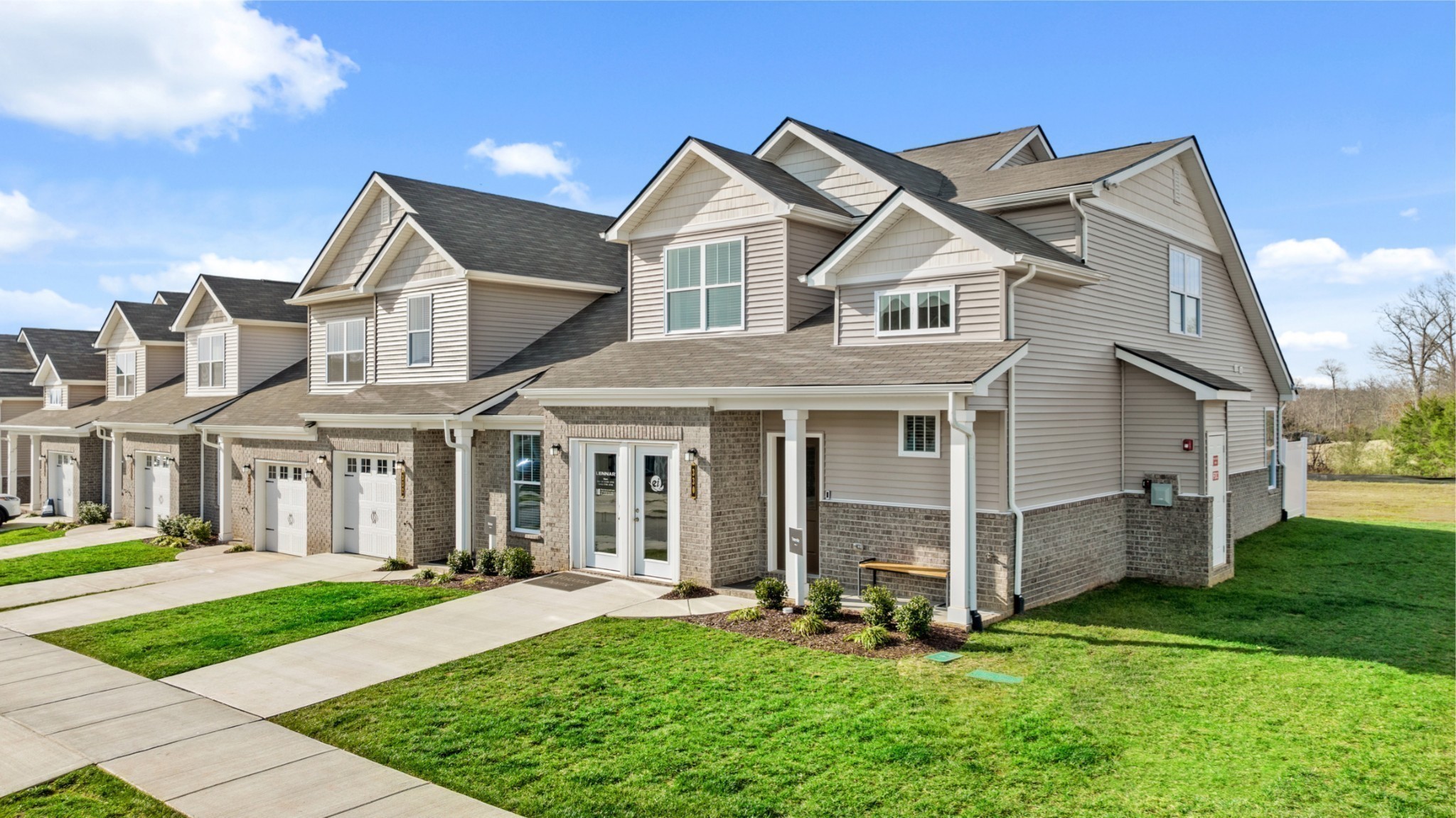 a front view of a house with a yard