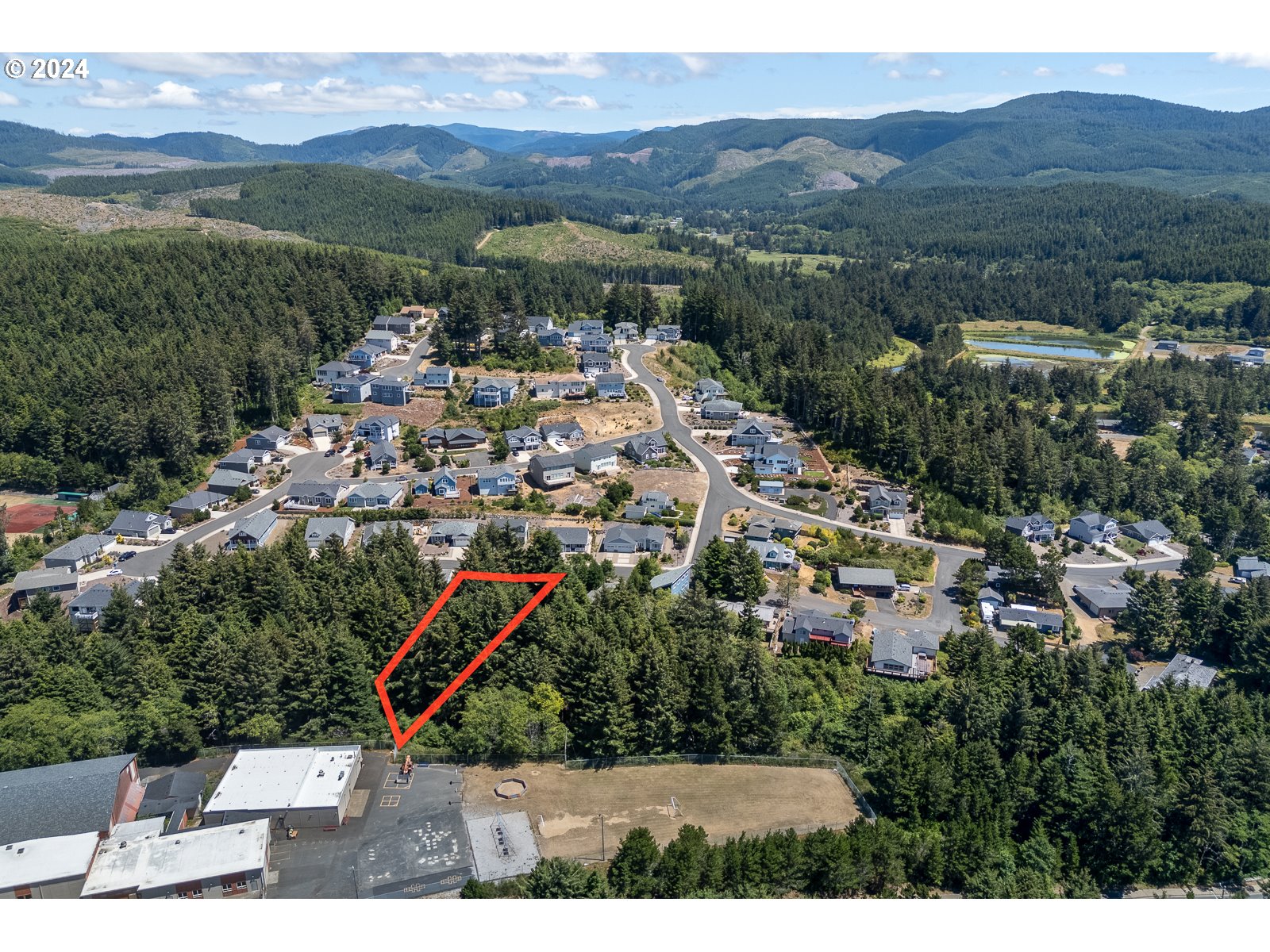 0 Southeast Inlet Avenue, Unit 34 Lincoln City, OR 97367 - Photo 7 of 9 a view of a city with mountain