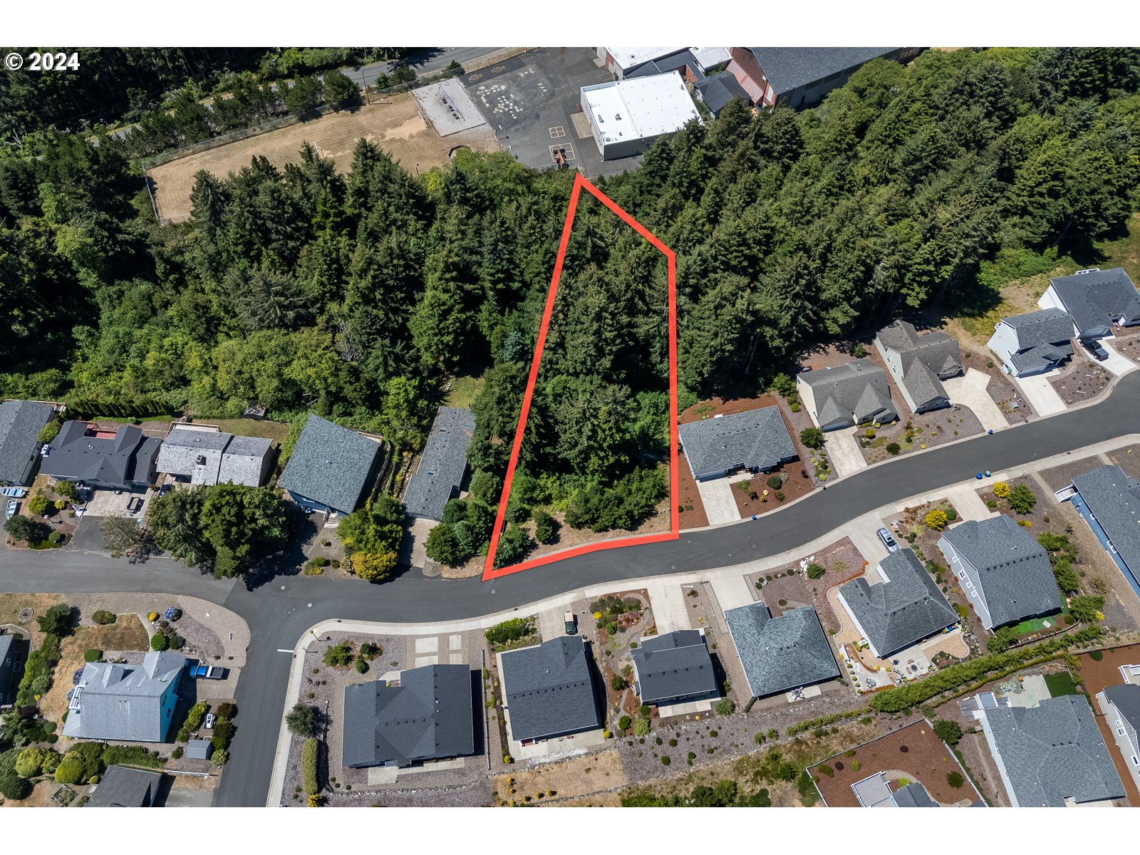 0 Southeast Inlet Avenue, Unit 34 Lincoln City, OR 97367 - Photo 8 of 9 an aerial view of a house with a swimming pool