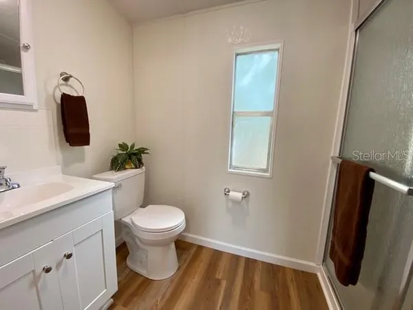 a bathroom with a toilet and a sink