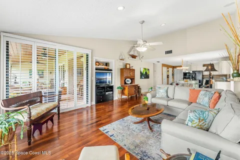 a bedroom with furniture and a chandelier