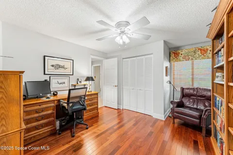 an aerial view of a house with swimming pool garden and patio