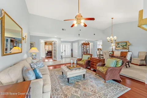 a kitchen with stainless steel appliances granite countertop a refrigerator a sink a stove and a sink