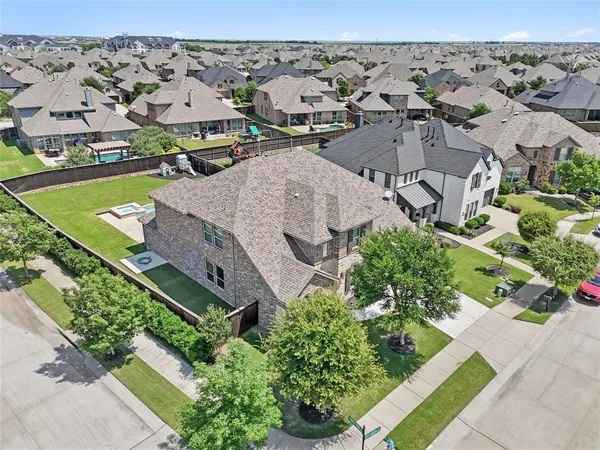 an aerial view of a house with a garden