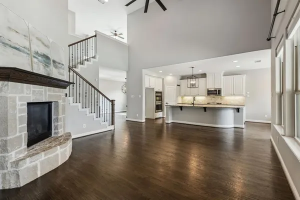 a view of kitchen with furniture and wooden floor