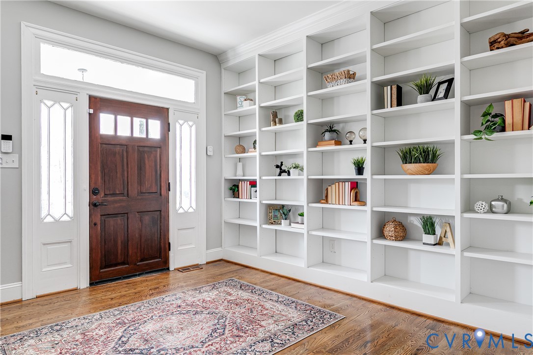 112 West Lancaster Road Richmond, VA 23222 - Photo 5 of 40 A wall of custom built bookshelves greet you at th