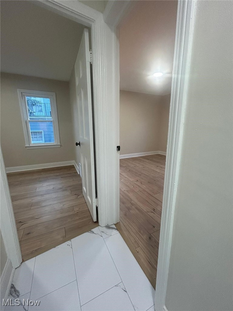 15410 Turney Road Maple Heights, OH 44137 - Photo 20 of 46 Hallway featuring light wood finished floors