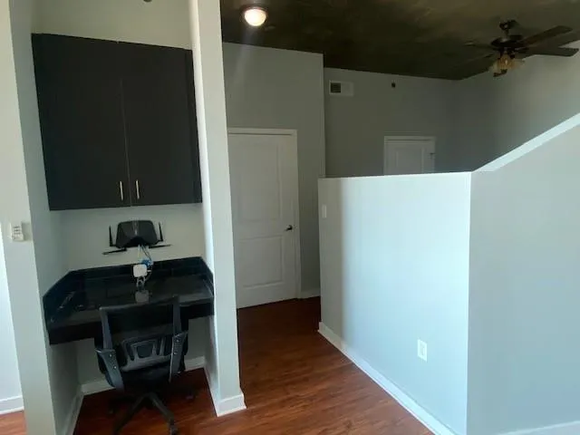 a view of workspace with wooden floor