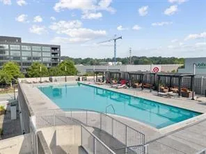 a view of swimming pool with outdoor seating