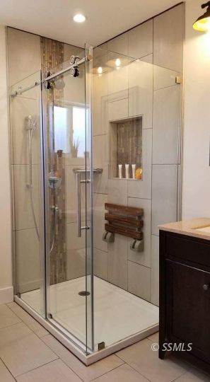 727 North Sanders Street Ridgecrest, CA 93555 - Photo 17 of 27 a bathroom with a shower and a sink