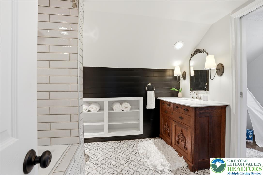 2014 Linden Street Bethlehem, PA 18017 - Photo 40 of 85 A stylish bathroom offers a richly detailed wooden vanity and patterned tile flooring.