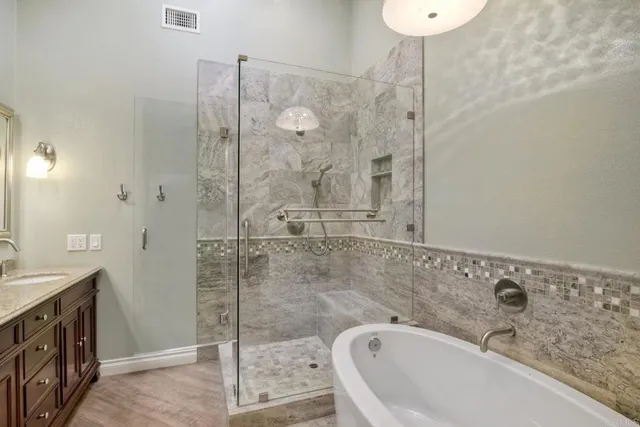 a bathroom with a bathtub and a sink
