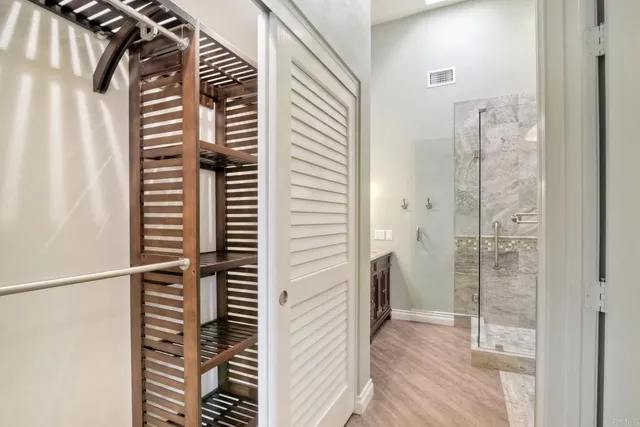 a bathroom with a shower and a sink