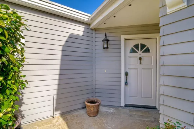 a view of a door and a window