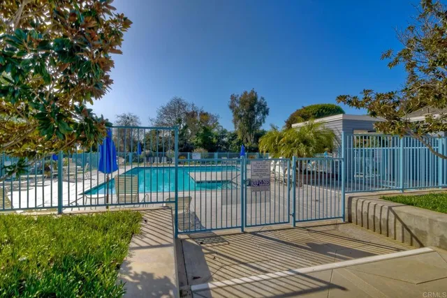 a view of a wrought iron fences in front of house