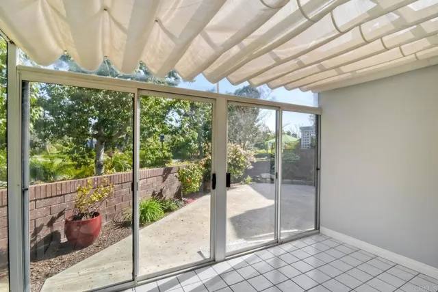 a view of a room with wooden floor and iron stairs