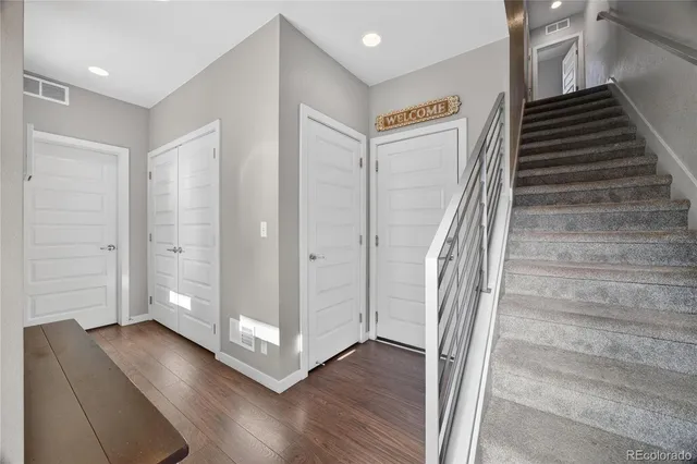 a view of entryway with wooden floor