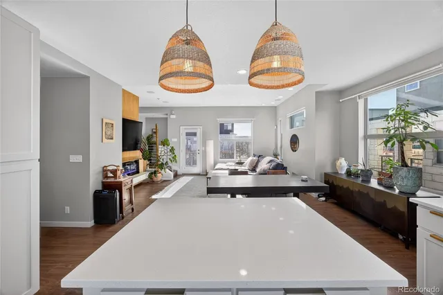 a living room with dining table and chairs