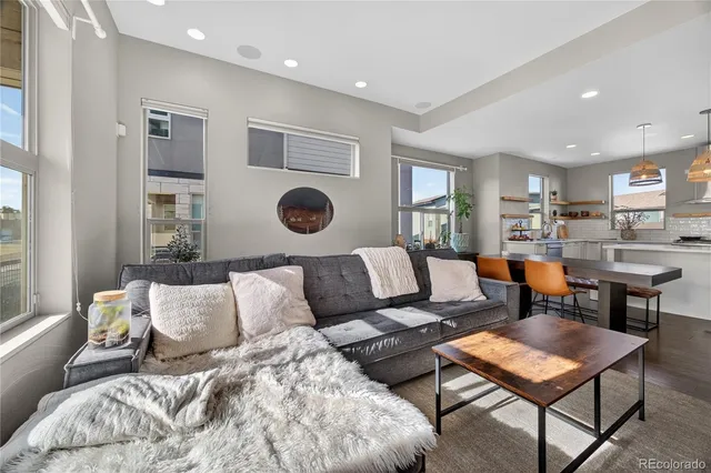 a living room with furniture and a table